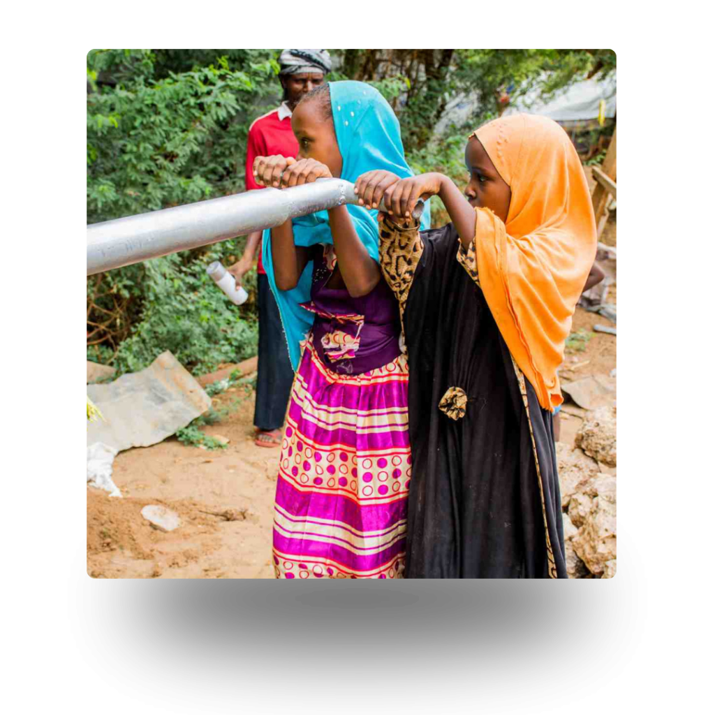 community gather around a water well